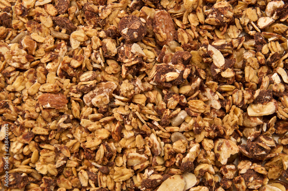 Looking down on home made, all natural, organic granola with chocolate. The cereal fills the entire image. Looking down on home made, all natural, organic granola with chocolate. The cereal fills the entire image.