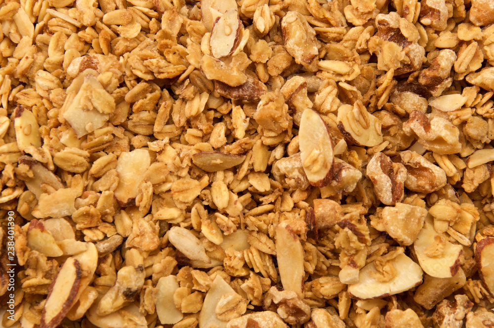 Looking down on home made, all natural, organic granola. The cereal fills the entire image. Looking down on home made, all natural, organic granola. The cereal fills the entire image.