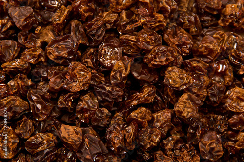 Fresh homemade organic green grape raisins fills entire image, shot from above.