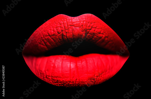 Red lips. Sensual lips in black background. Sexy texture lips and matte lipstick. Purple matt lipstick. Lip isolated.