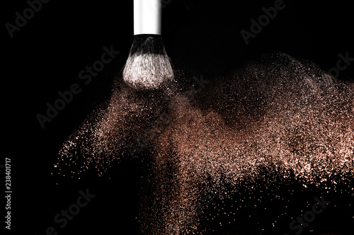 Living Coral Color of the year 2019, powder splash and brush for makeup artist or beauty blogger in black background