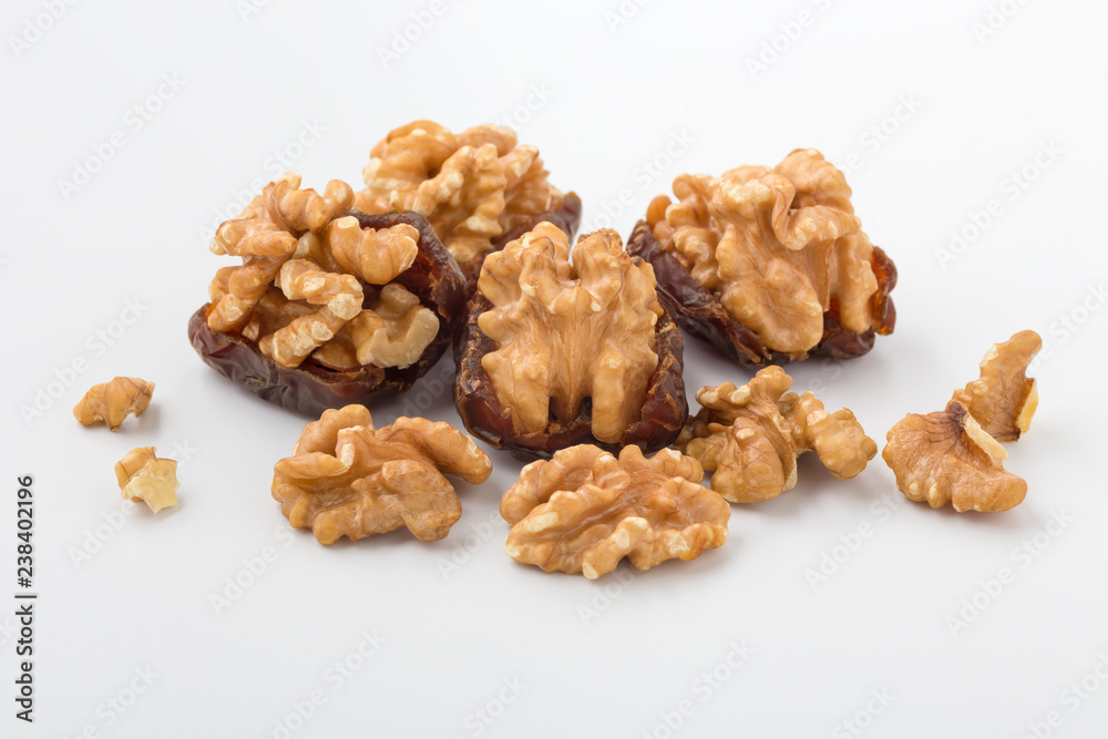 Fototapeta premium Walnuts with dates, healthy snack