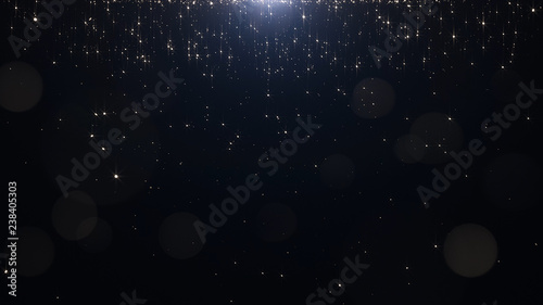 Glamorous golden particles on a black background