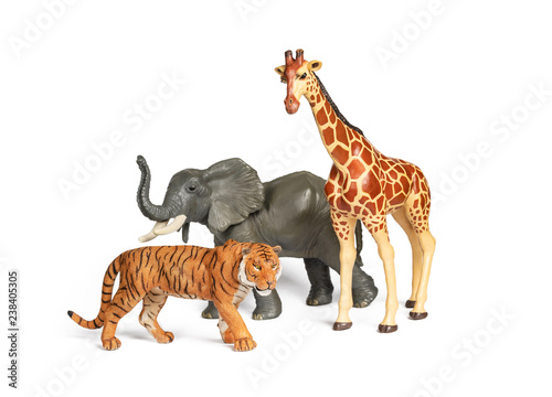 Fototapeta Naklejka Na Ścianę i Meble -  Pastic wild african animal toys isolated on white. Tiger, Elephant and giraffe. Children animal characters for playing zoo game