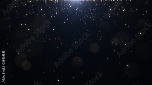 Glamorous golden particles on a black background © davstudio