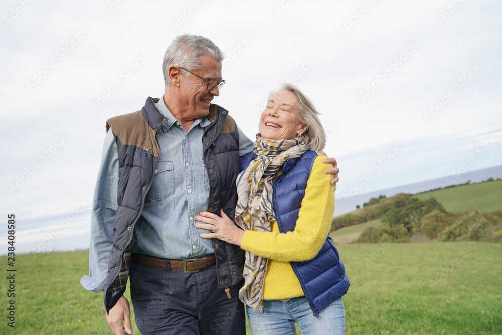 Healthy senior couple on countryside walk Healthy senior couple on countryside walk
