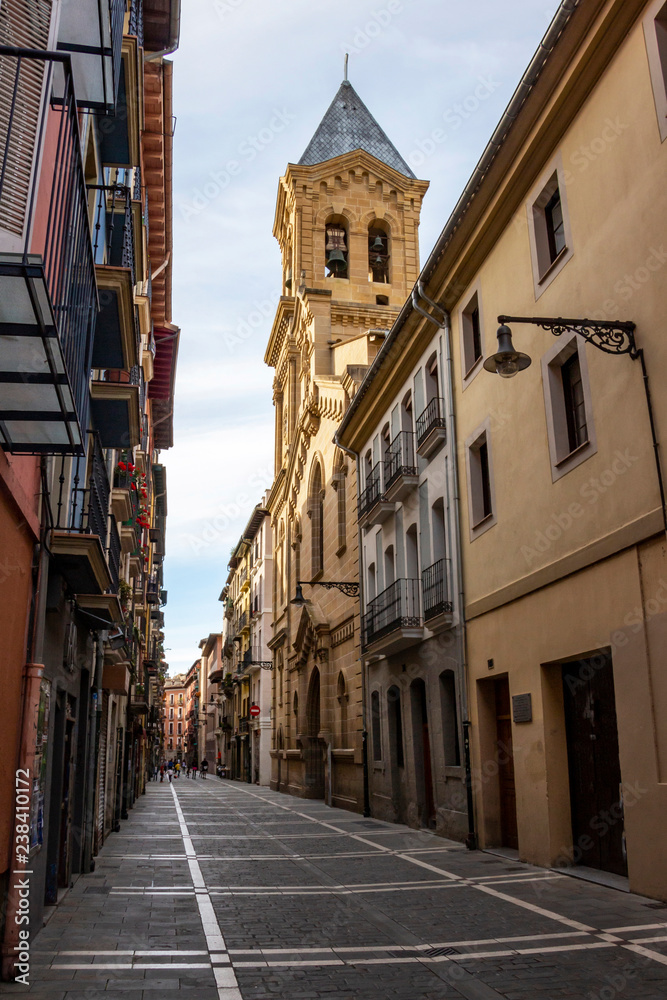Calle San Agustin, San Agustin Street with the tower of St. Augustine Church in the background, in Pamplona, Navarre Spain