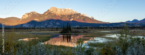 Beautiful panoramic landscape of the Canadian Rocky Mountains during a sunny sunrise. Taken in Jasper National Park, Alberta, Canada.