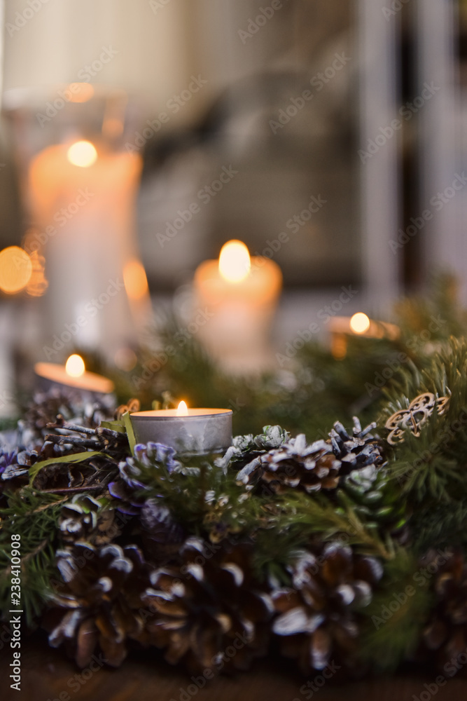 Christmas, Advent Decorative Wreath Candle Decoration. In a burning candle in a beautiful decorative wreath.