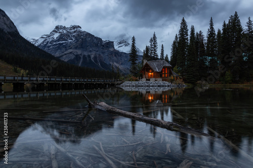 Beautiful view of a cabin near a glacier lake with Canadian Rocky Mountains in the background. Taken in Emerald Lake, British Columbia, Canada.