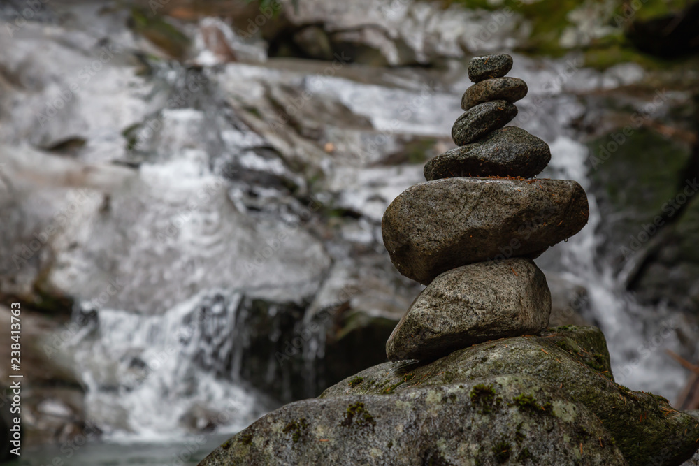 Stack of Rocks near a waterfall. Taken in Mt Fromme, North Vancouver, British Columbia, Canada. Stack of Rocks near a waterfall. Taken in Mt Fromme, North Vancouver, British Columbia, Canada.