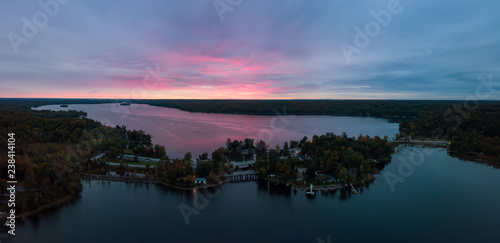 Aerial Panoramic view of Moira Lake during a striking and colorful sunrise. Taken in Madoc, Ontario, Canada.