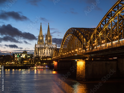 December 2018  Sunset sky with clouds over the city skyline Cologne with Bridge and K  ln Dom  Evening scene over Cologne Koln city with Kolner Dom Cathedral behind the Hohenzollern bridge