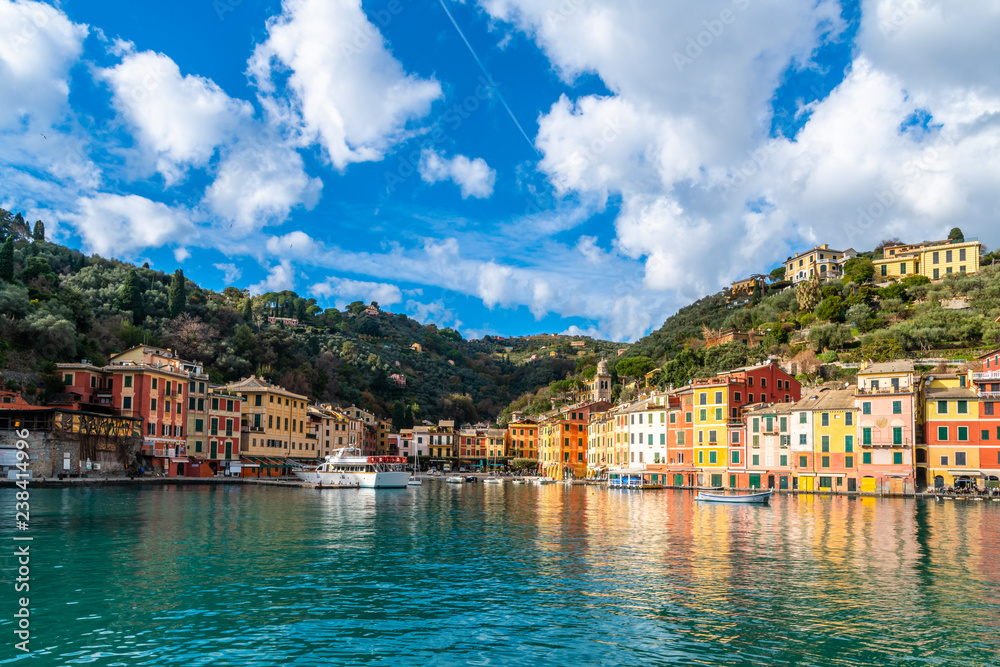 City view of Portofino in Liguria with a harbour and boat from the sea