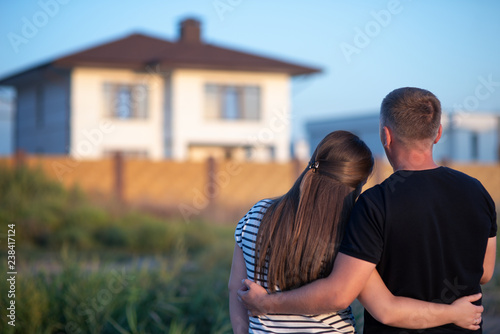 Couple looking at they's house