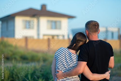 Couple looking at their home