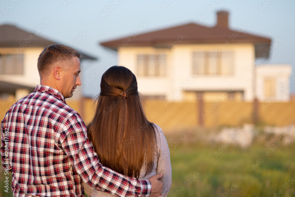 Couple looking at their house