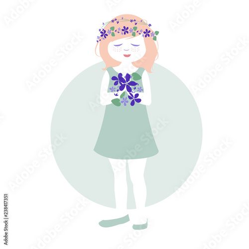 Little girl with garlands of flowers in her hair holding a bouquet of wild violets