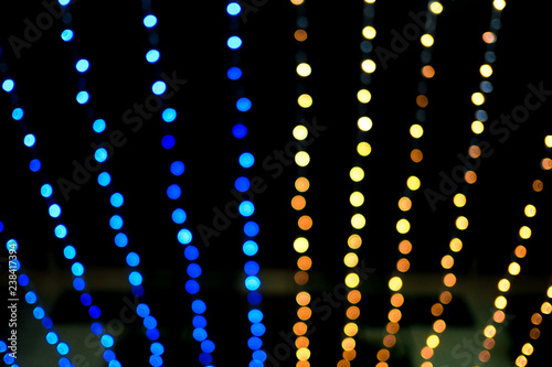 blue and yellow gold Bokeh beautiful shine line of lights background , Christmas new year and holidays.