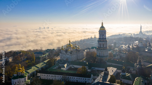 Aerial view of the Monument Motherland, shrouded in thick fog at dawn, Kiev, Ukraine. The concept of the apocalyptic doomsday.
