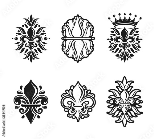 Lily Flowers Royal symbols, floral and crowns, emblems set. Heraldic Coat of Arms decorative logos isolated vector illustrations collection.