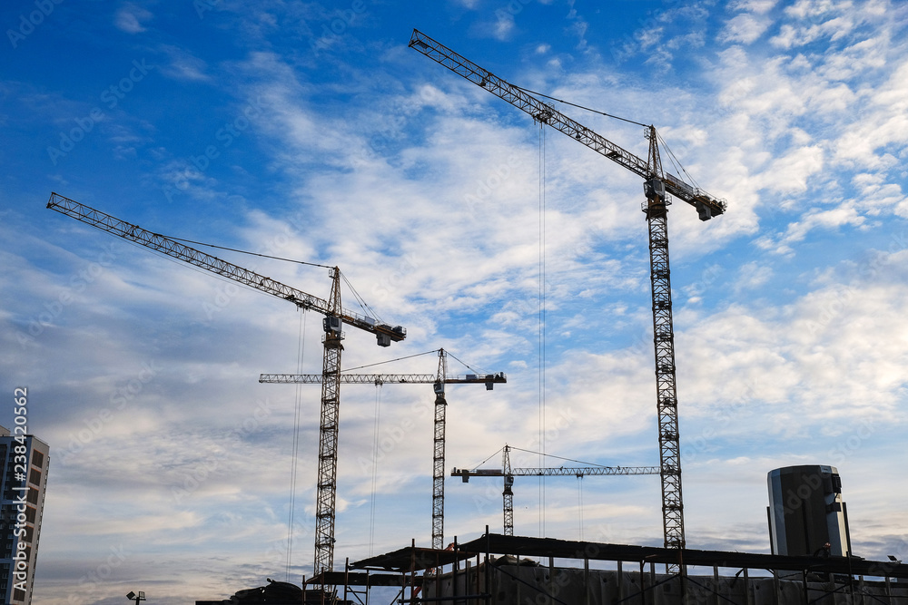 the high crane at a construction site