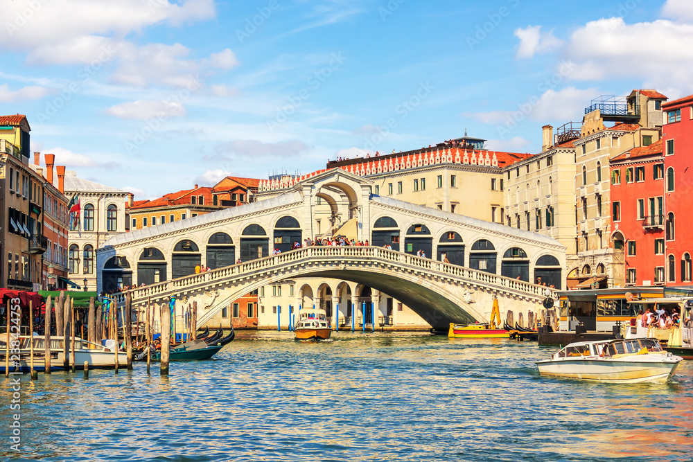 Rialto Bridge, a popular landmark of Venice, Italy, summer view