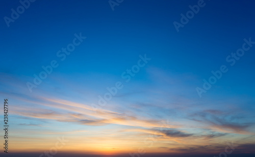 Colorful sunset sky over tranquil sea surface © Pakhnyushchyy