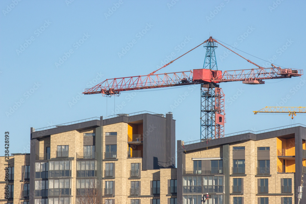 Construction of a modern residential building, the final work before the settlement of residents. Final preparations before the completion of the house Construction of a modern residential building, the final work before the settlement of residents. Final preparations before the completion of the house