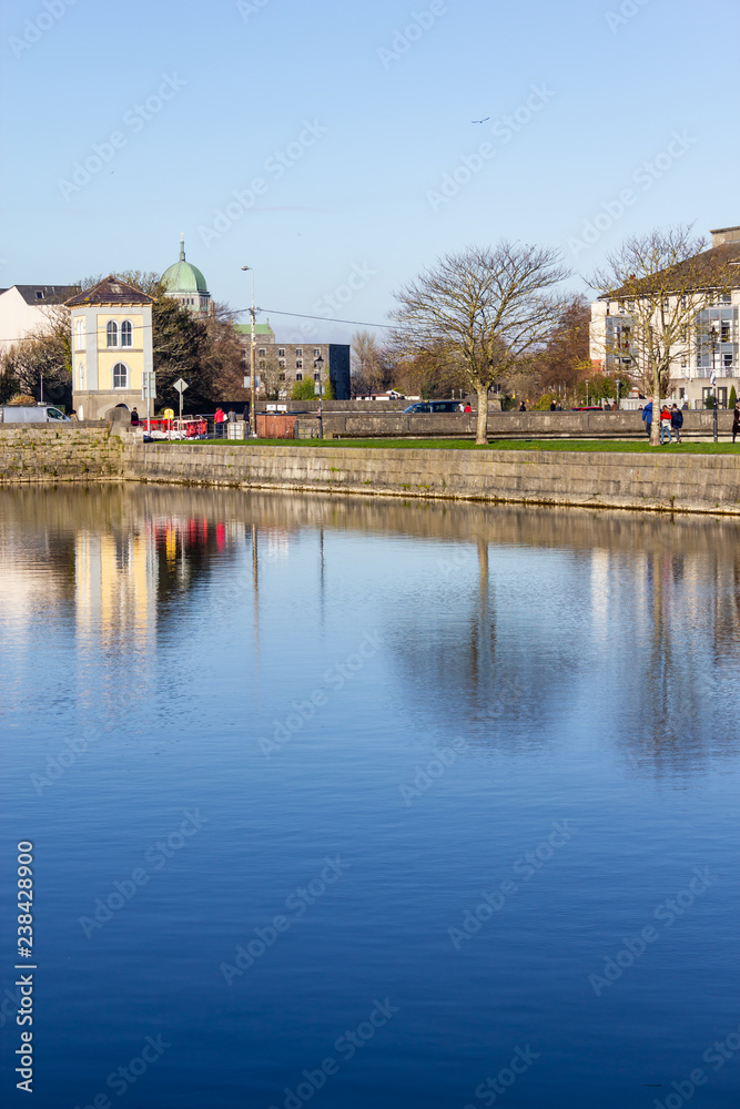 Building reflection in Corrib river pier Building reflection in Corrib river pier