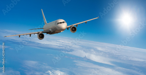 Passenger airplane flying at flight level high in the sky