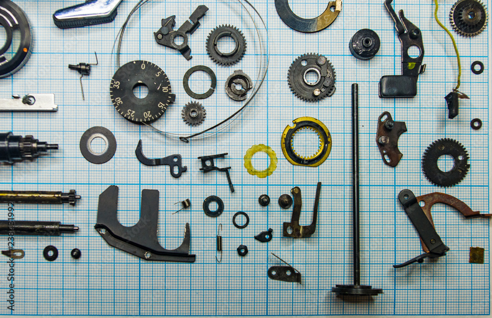 Fototapeta premium parts old retro film SLR camera on graph paper