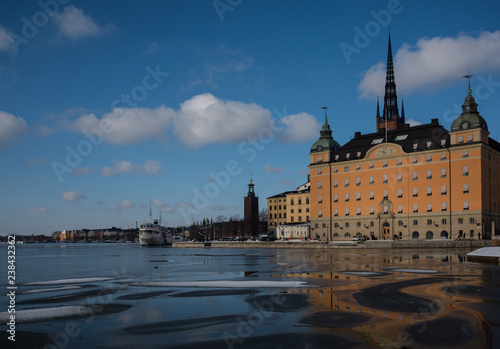 Winter view of Stockholm a frozen lake Mälaren and snow over the Town City Hall and the island Riddarholmen 