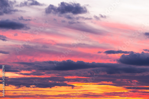 Beautiful soft dramatic sunset orange pink sky with clouds background © Viktor Iden