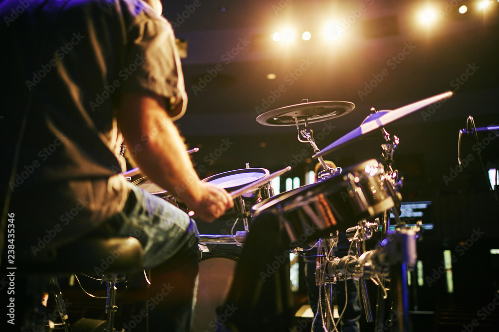 Man from behind playing drums at concert stock photo adobe stock