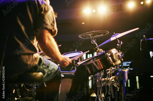 Canvas Print man from behind playing drums at concert