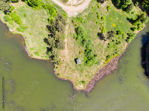 Green lake and pasture from above