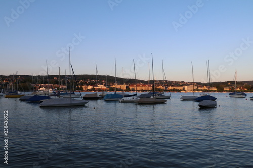 sunset over boats in a marina