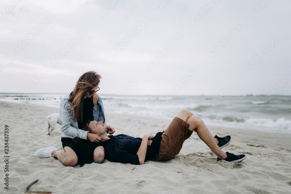 Young beautiful couple on a sea shore