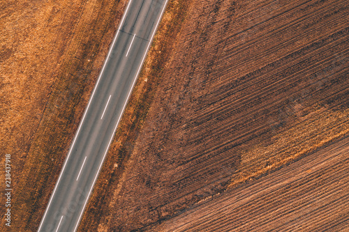 Aerial view of empty road through countryside