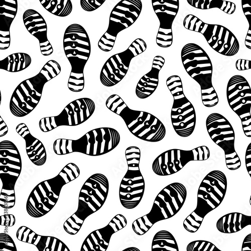 Vector seamless pattern with traces of shoes 