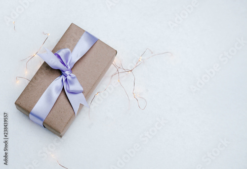 Merry Christmas and Holidays presents and gifts concept with a wrapped gift boxes on snow background with copy space