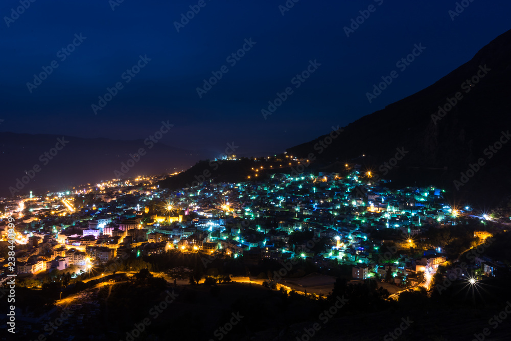 Fototapeta premium beautiful view of chefchaouen at night, from the spanish mosque on the top of the city. long exposure of chefchaouen, Morocco.