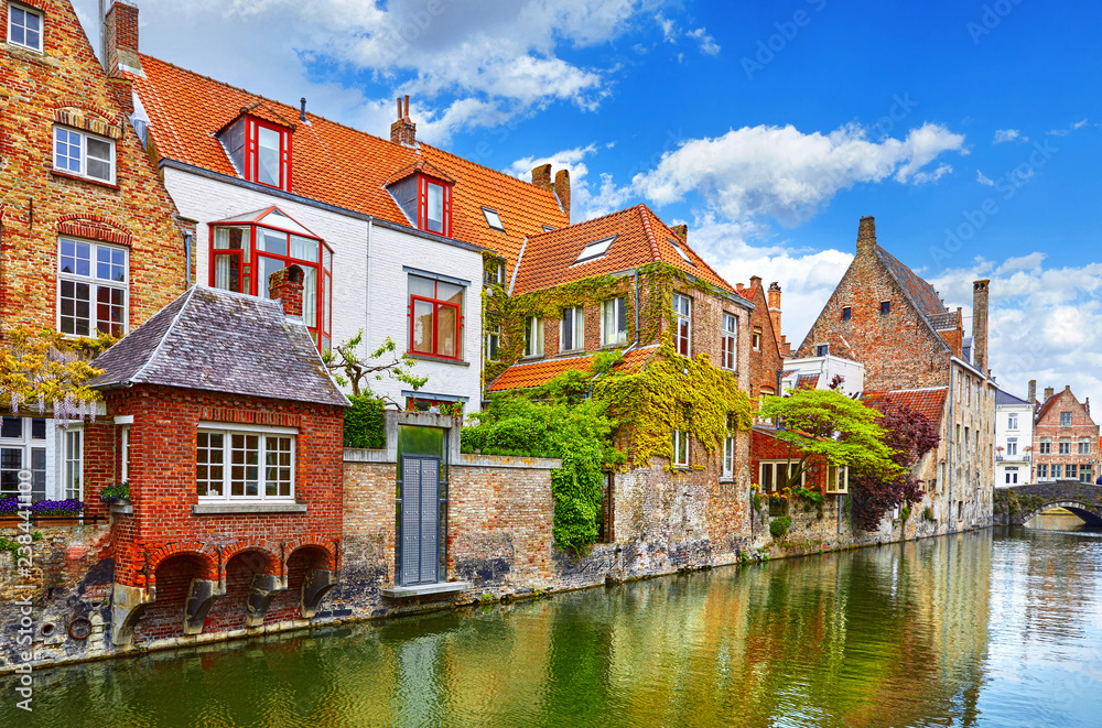 Bruges, Belgium. Medieval vintage brick houses with balconies