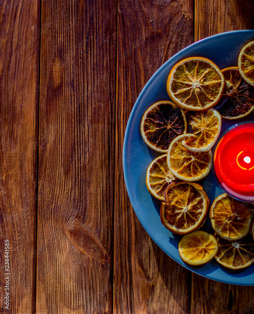 Decoration for the new year of citrus with a candle