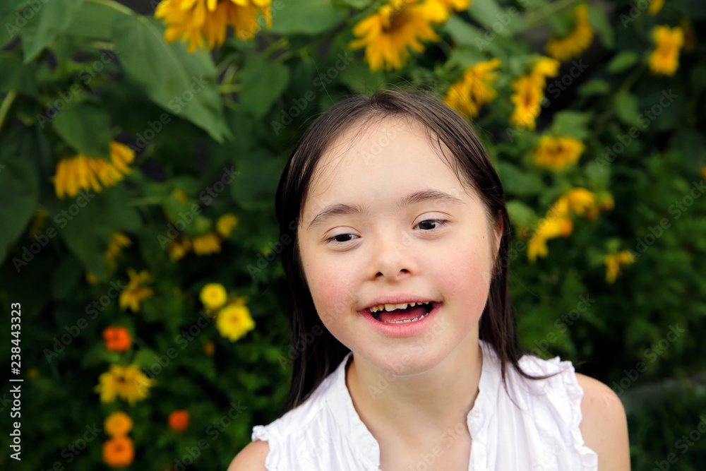 Portrait of little girl smiling in the garden Portrait of little girl smiling in the garden
