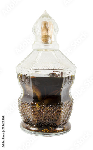 Herbal old potion in glass bottle isolated on white background