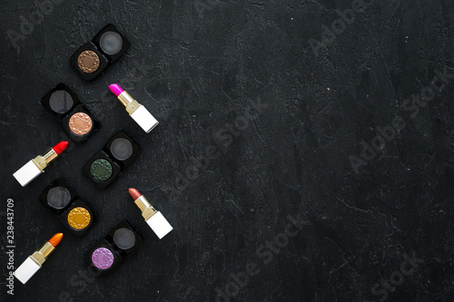 female desk with decorative cosmetics for make up dark background top view mockup