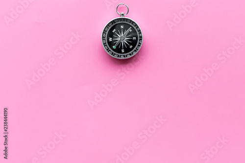 Direction of movement. Compass on pink background top view copy space