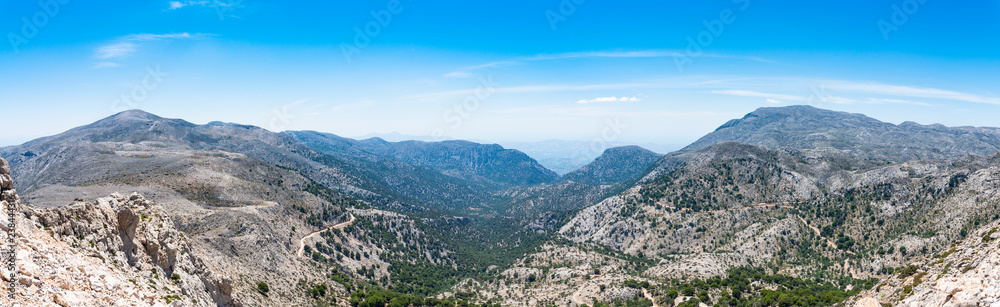 Psilorities mountain range panoramic skyline view. Mountaineering adventure trekking paradise, hiking paths, biking trails, challenging peaks at over 2000m altitude. Heraklion, Crete Greece.
